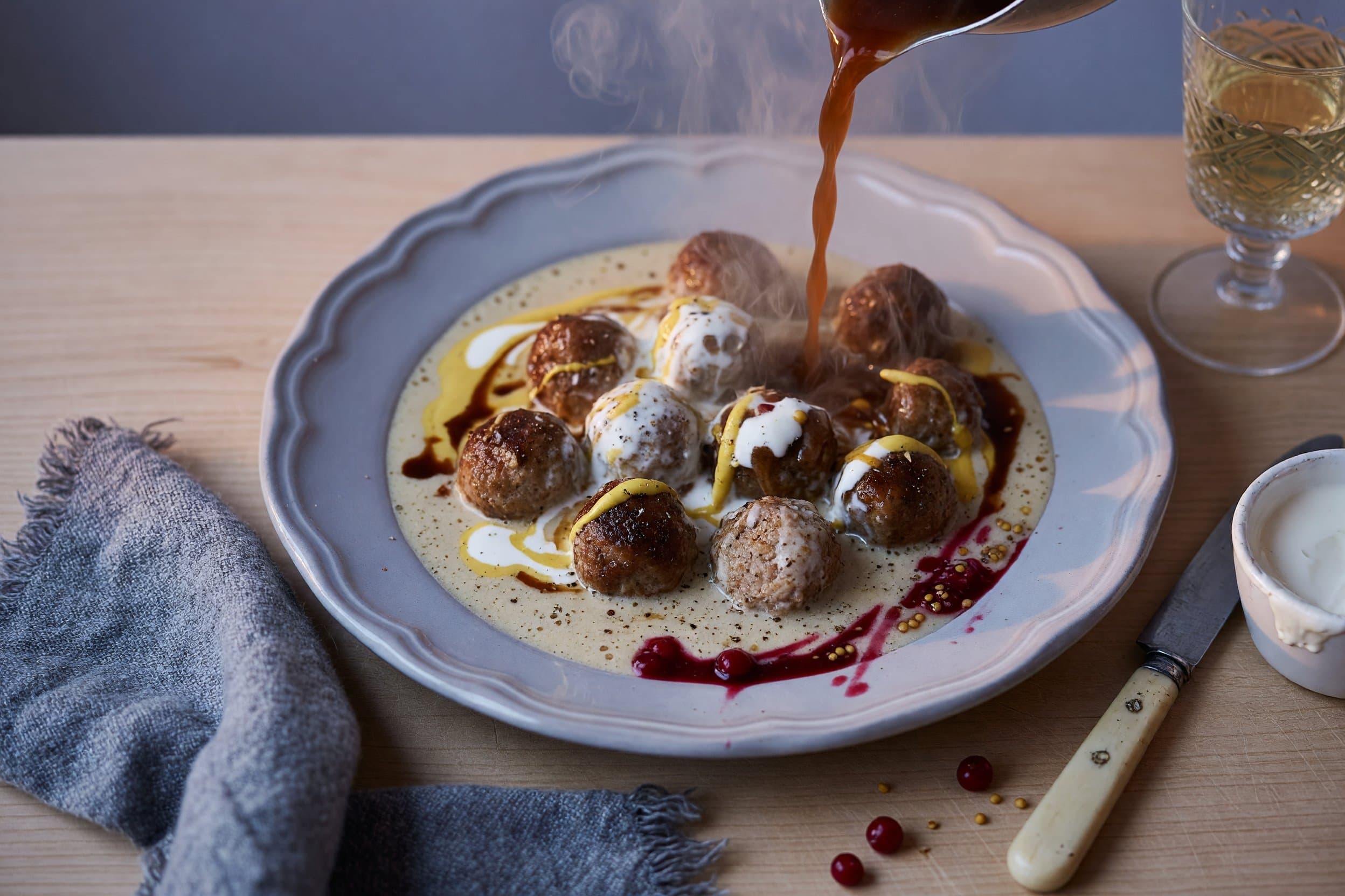 Add in your beef broth, mustard, Worcestershire sauce and sour cream while preparing Swedish Meatballs
