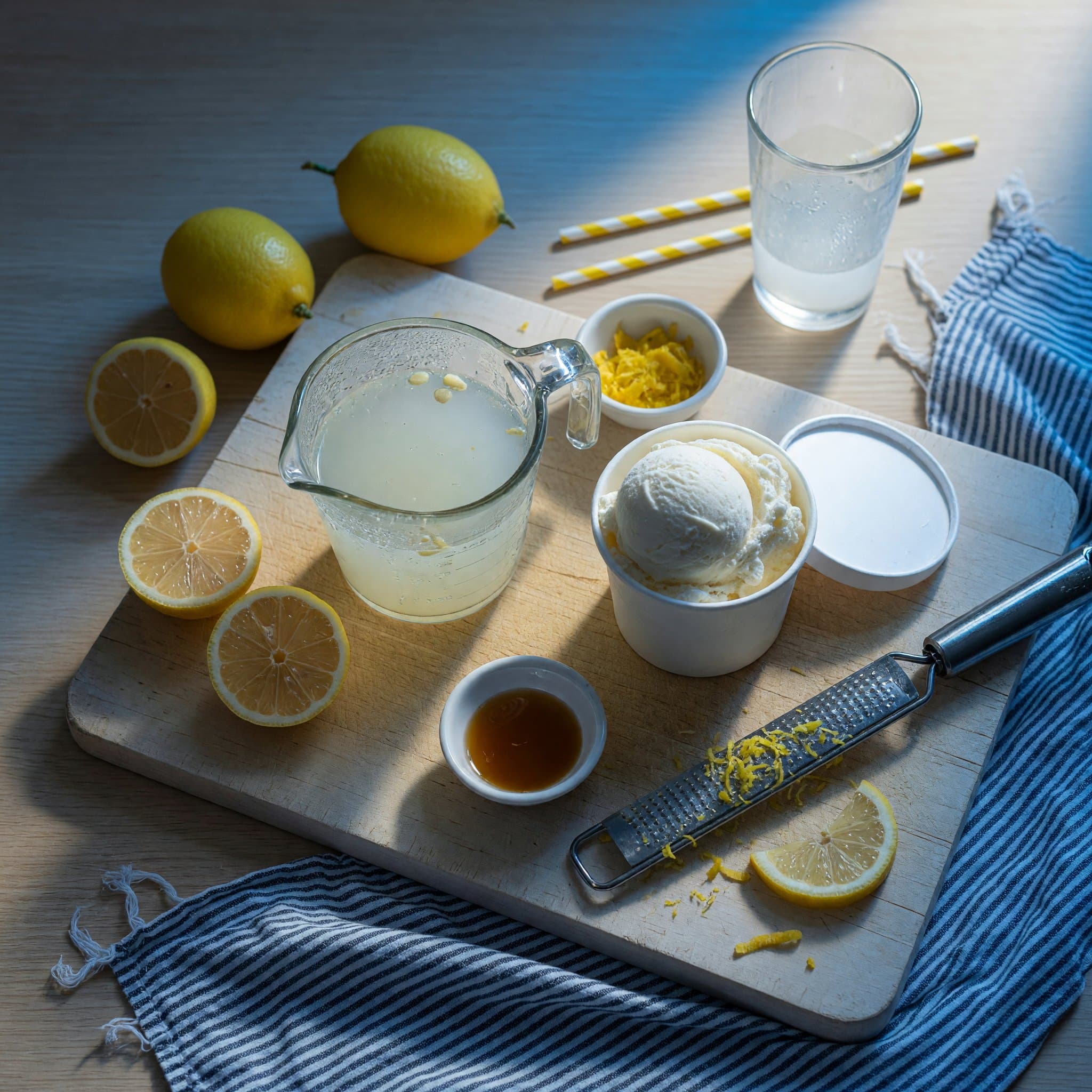 Overhead view of Lemonade, Vanilla Ice Cream and Lemon arranged on a table