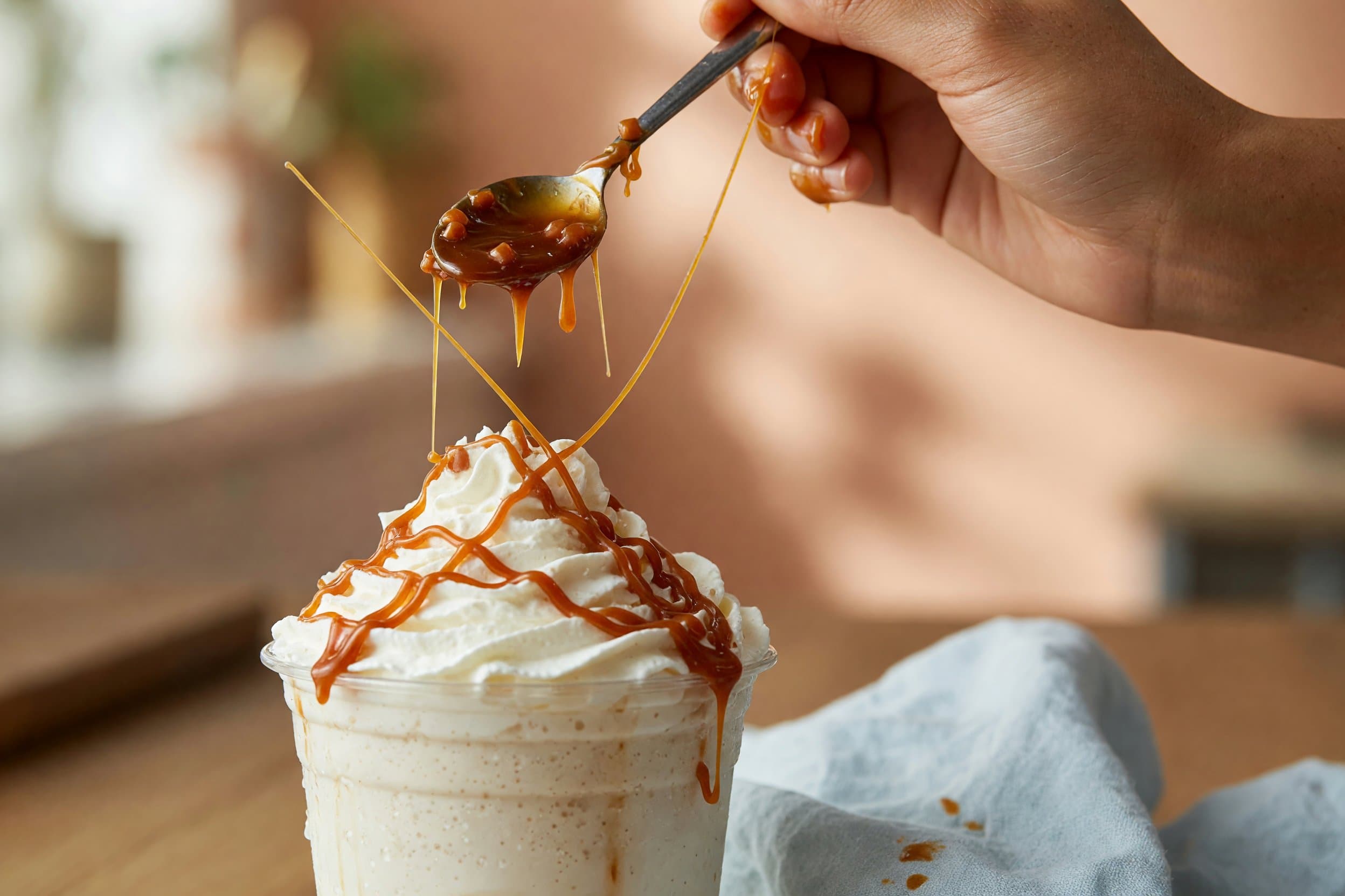 Glazing caramel sauce while preparing Homemade Caramel Frappuccino