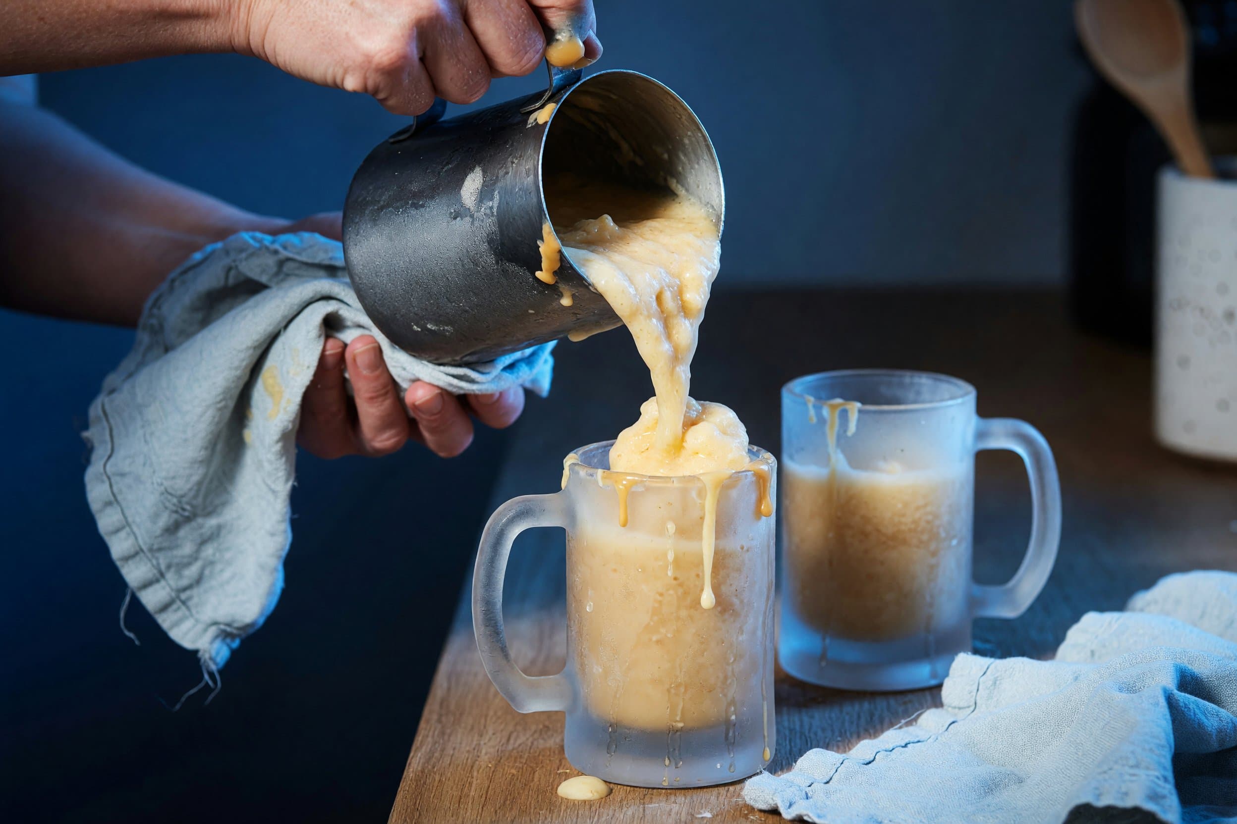 Pouring frozen butterbeer mixture while preparing Harry Potter's Frozen Butterbeer