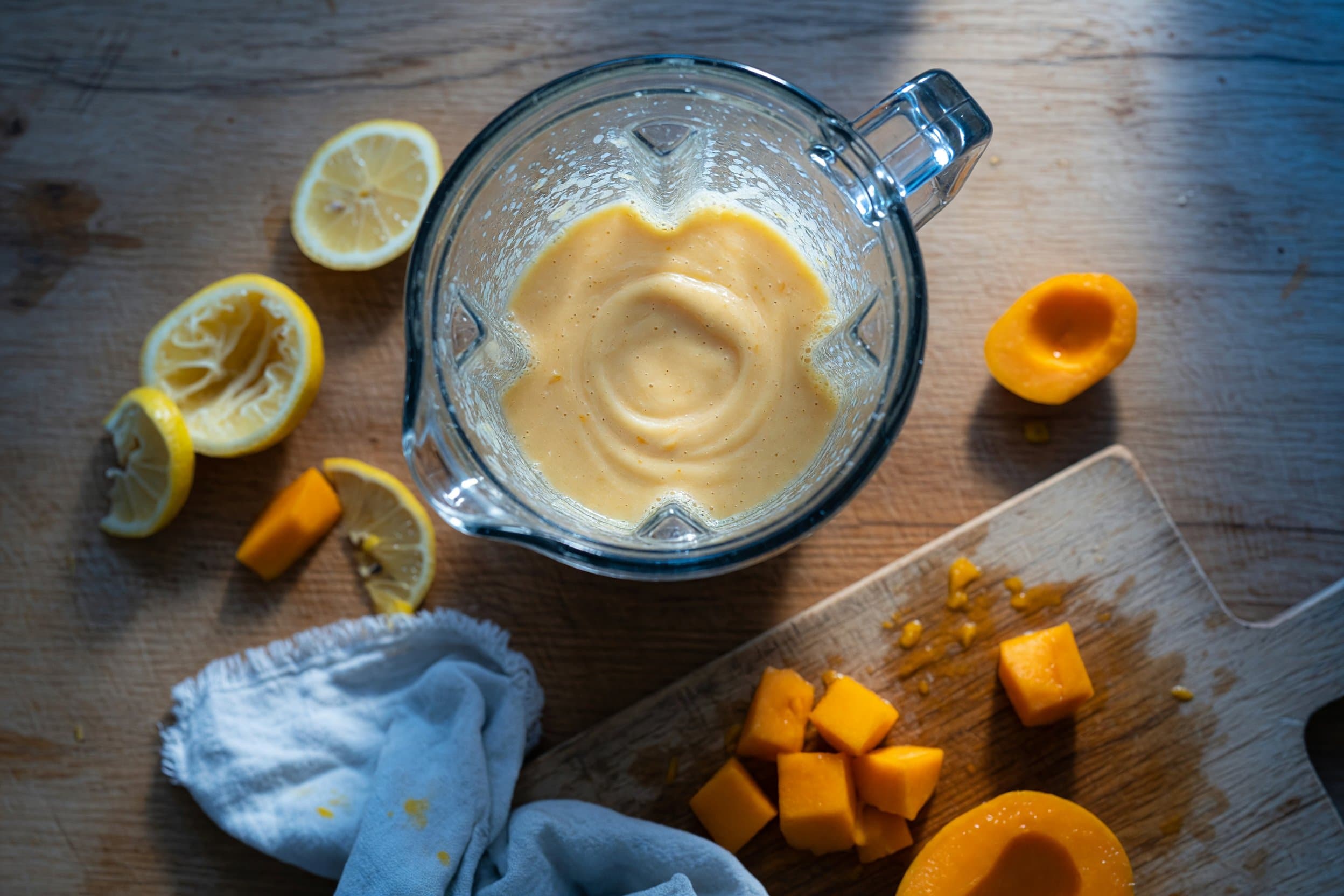 Whisking lemonade, frozen mango, ice, and xanthan gum while preparing Easy Frozen Mango Lemonade