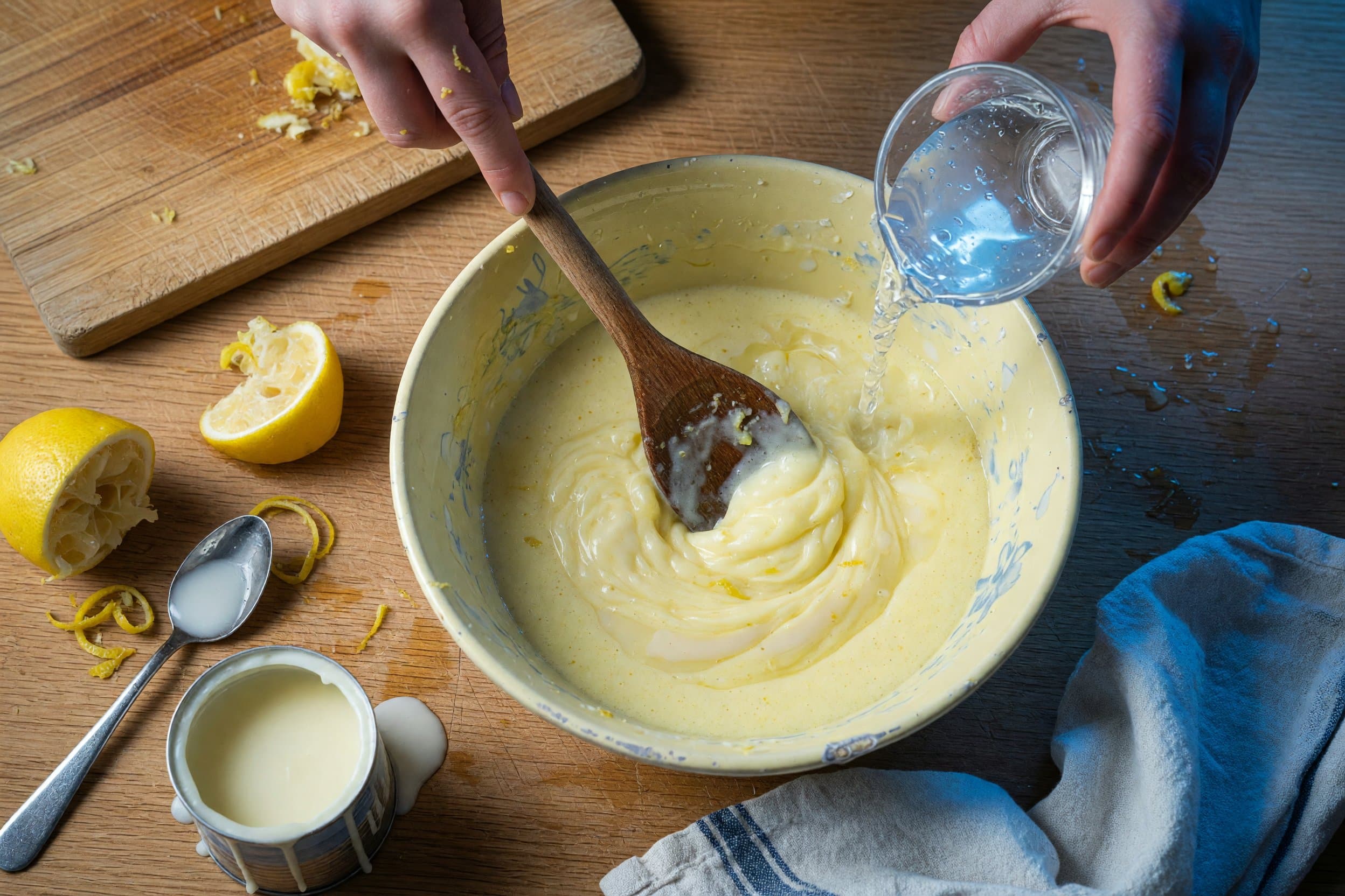 Stirring water and blended mixture while preparing Creamy Lemonade Recipe