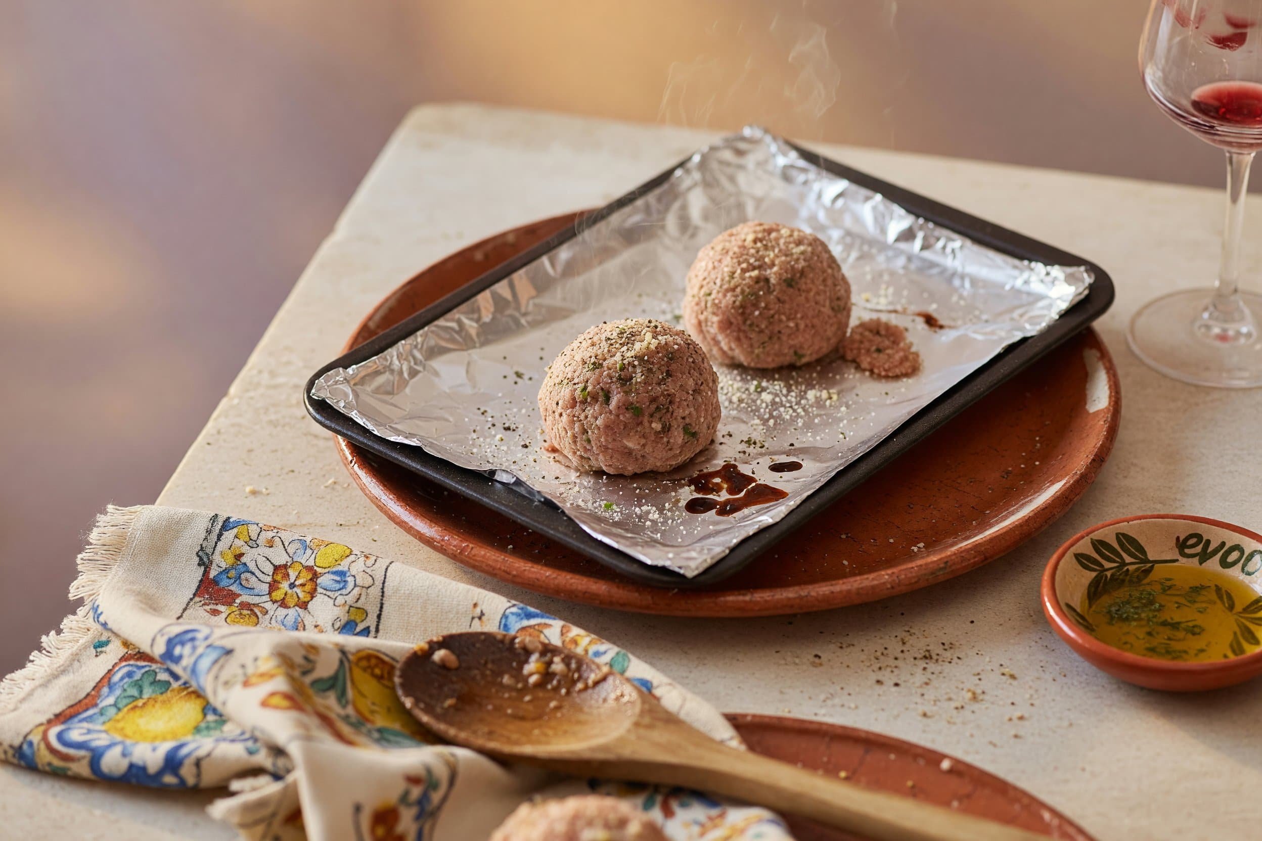 Now shape the mixture into balls and place them on an aluminum foil lined baking while preparing The Best & Easiest Meatballs