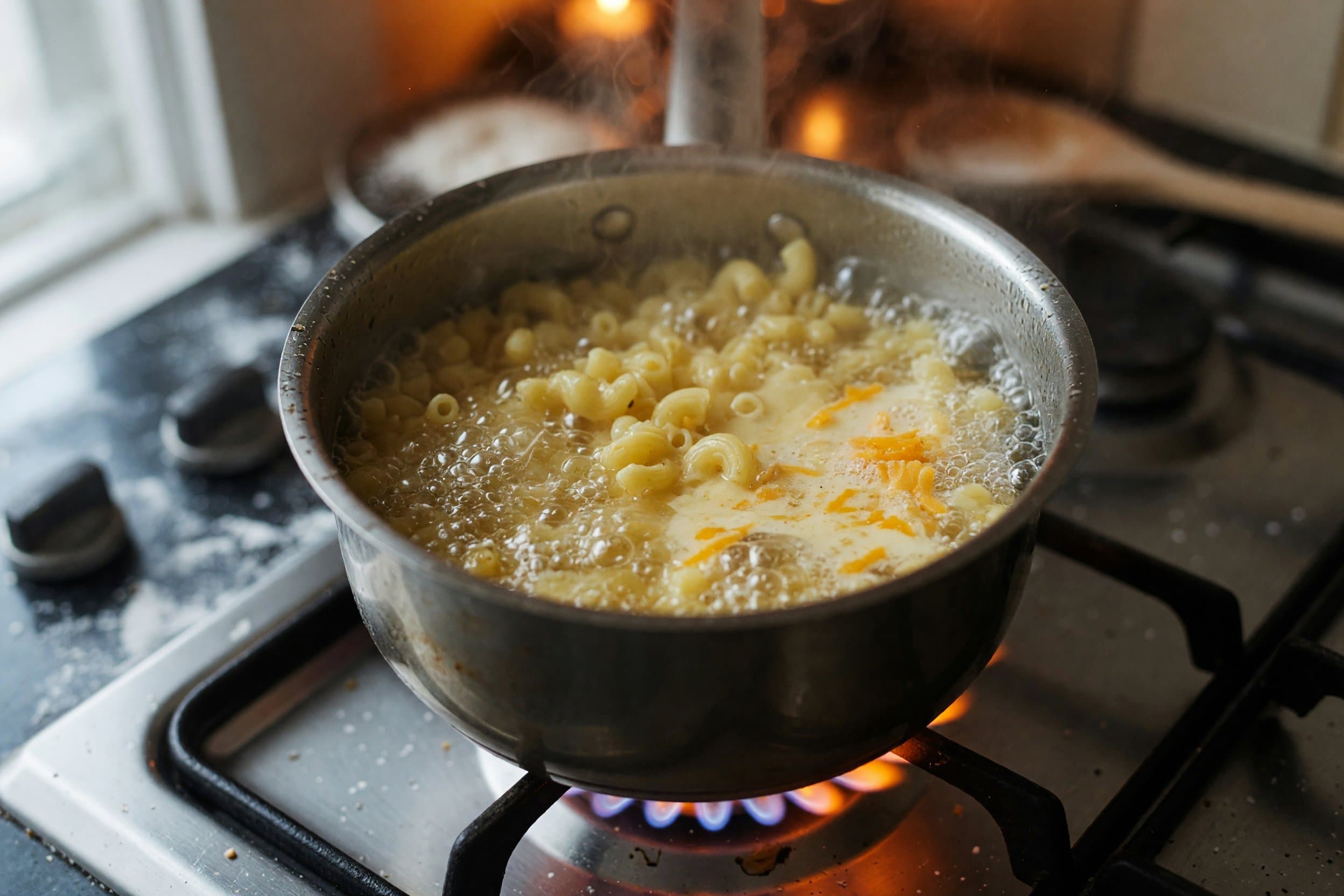 Baking macaroni pasta while preparing Smoked Gouda Mac and Cheese