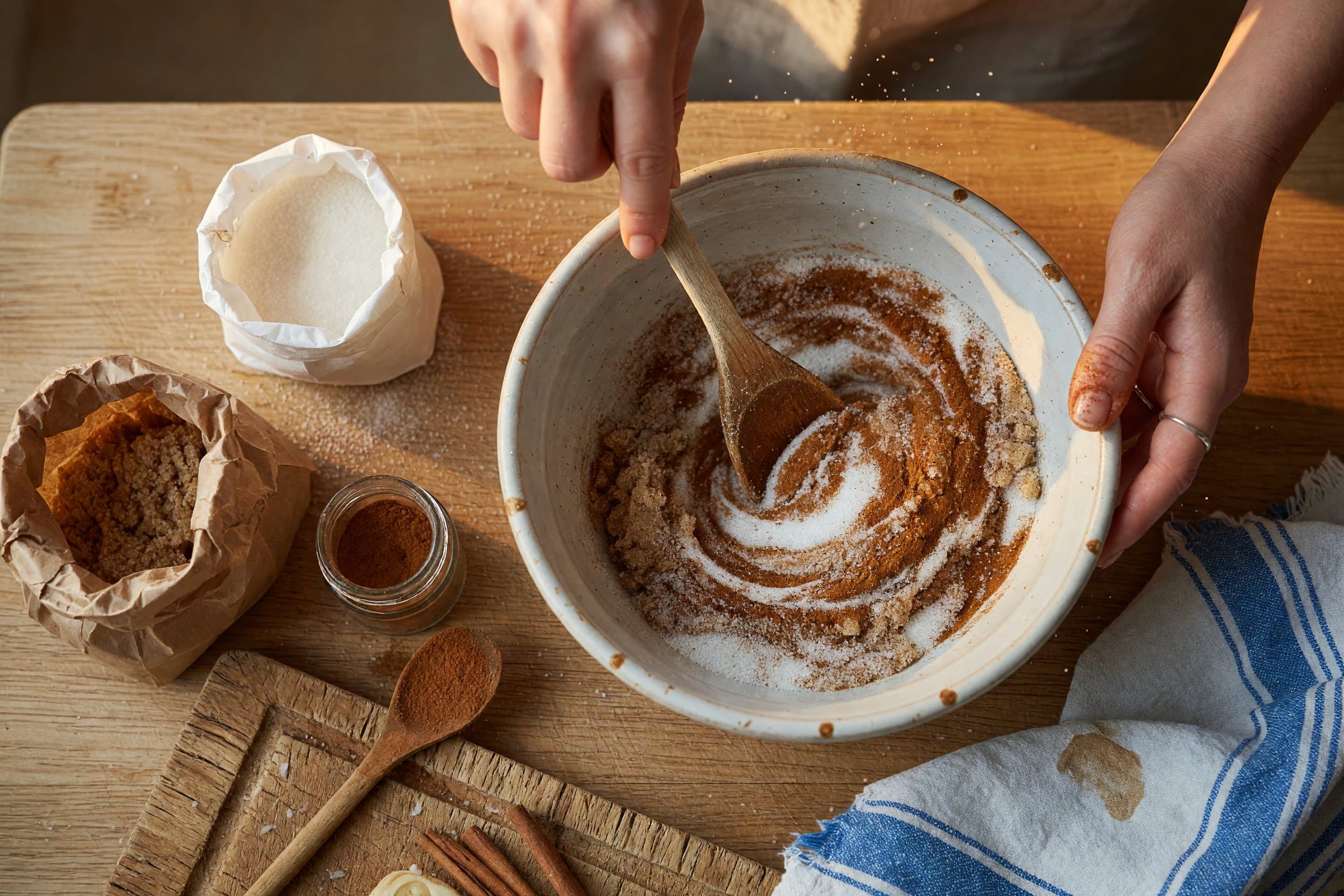Stirring granulated sugar, brown sugar, and cinnamon while preparing Skillet Monkey Bread