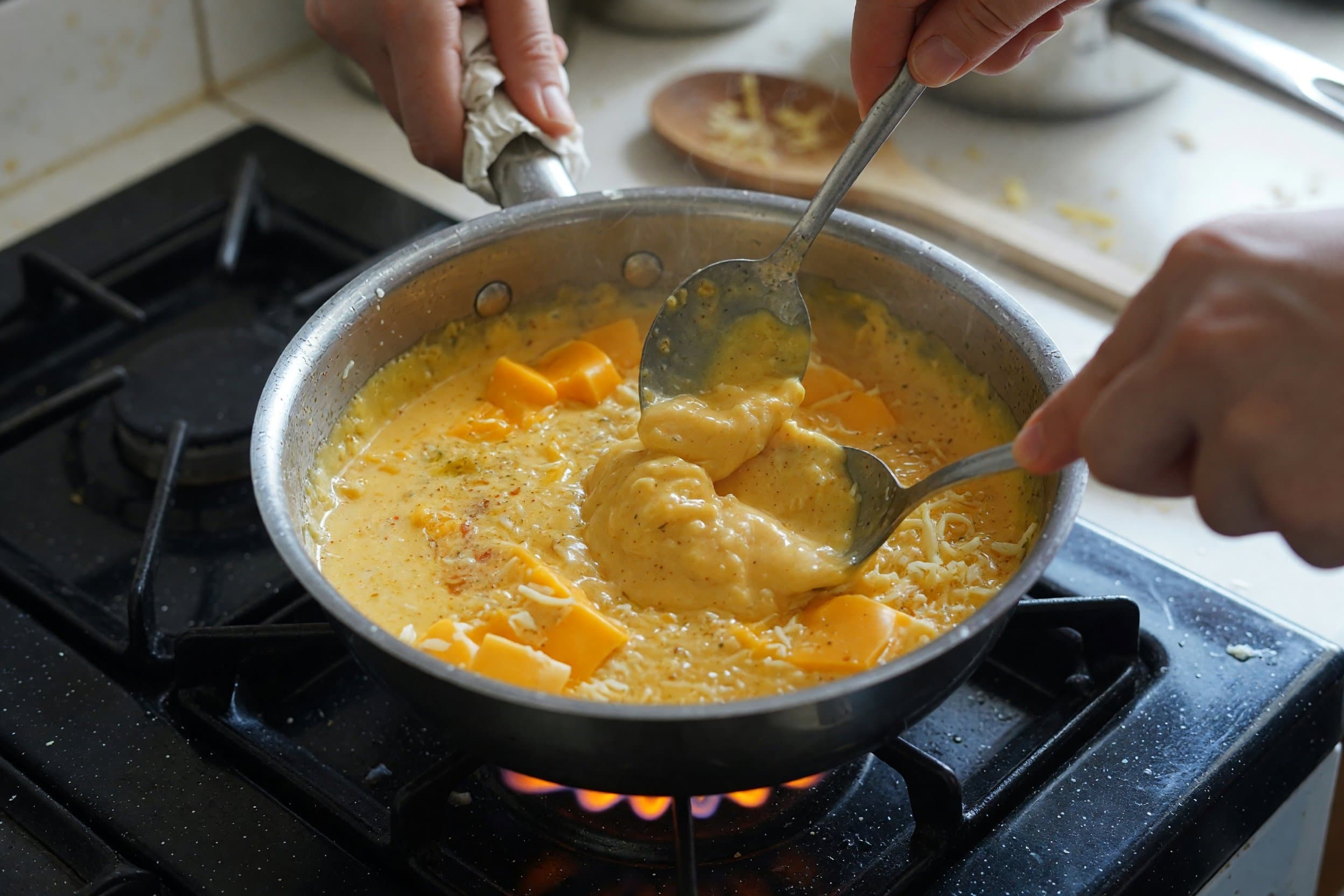 Stirring cheese mixture while preparing Taco Bell Nacho Cheese Recipe