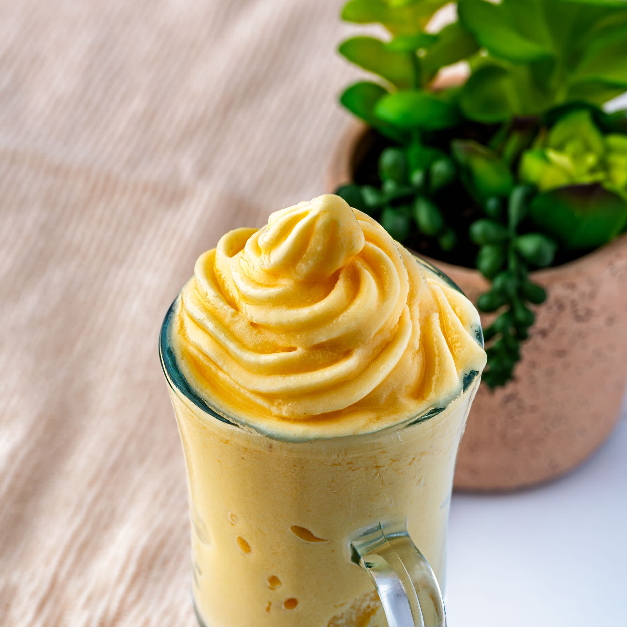 A swirl of coconut Dole Whip, straight out of the blender and ready to eat.