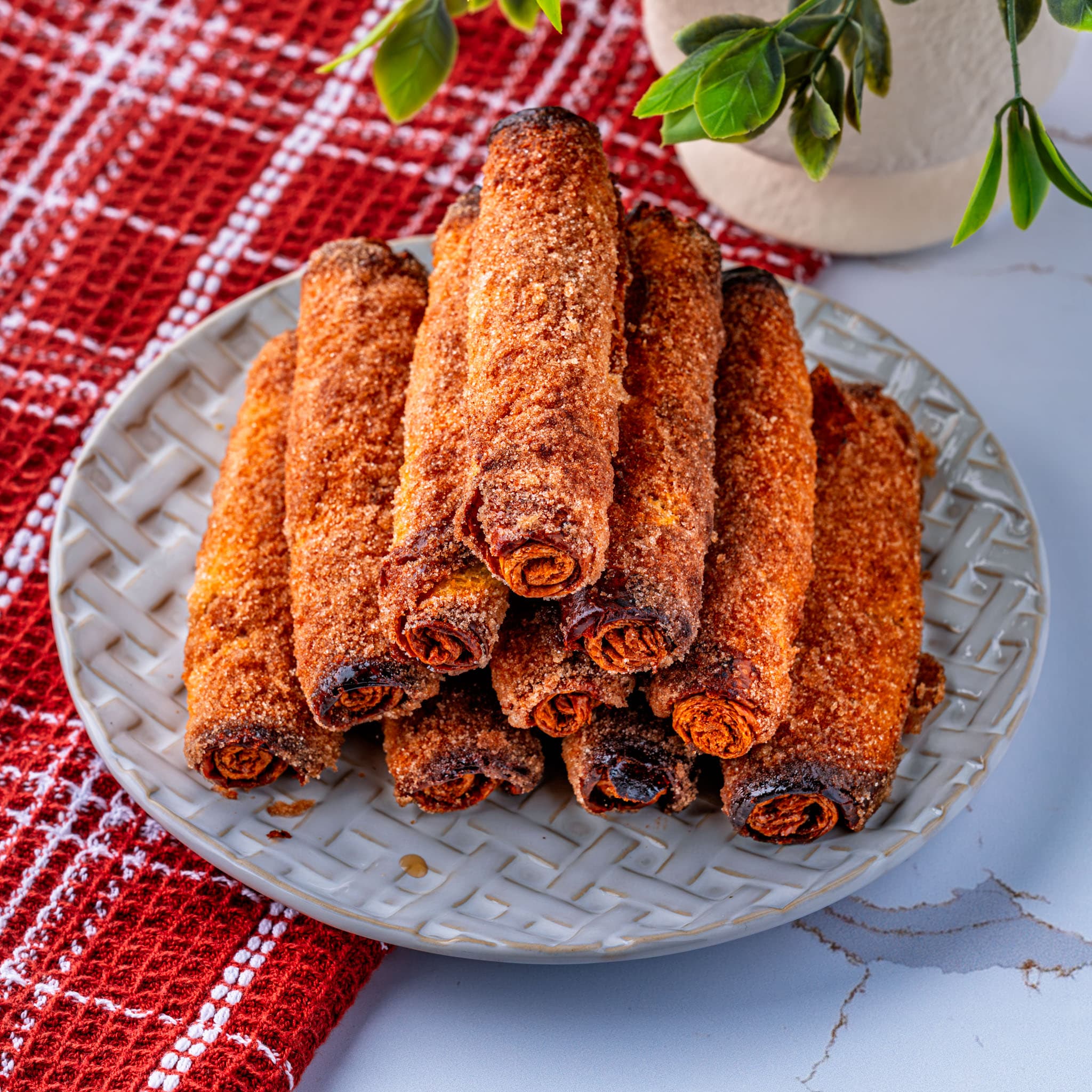 Golden cinnamon-sugar French toast sticks stacked and ready for dipping.