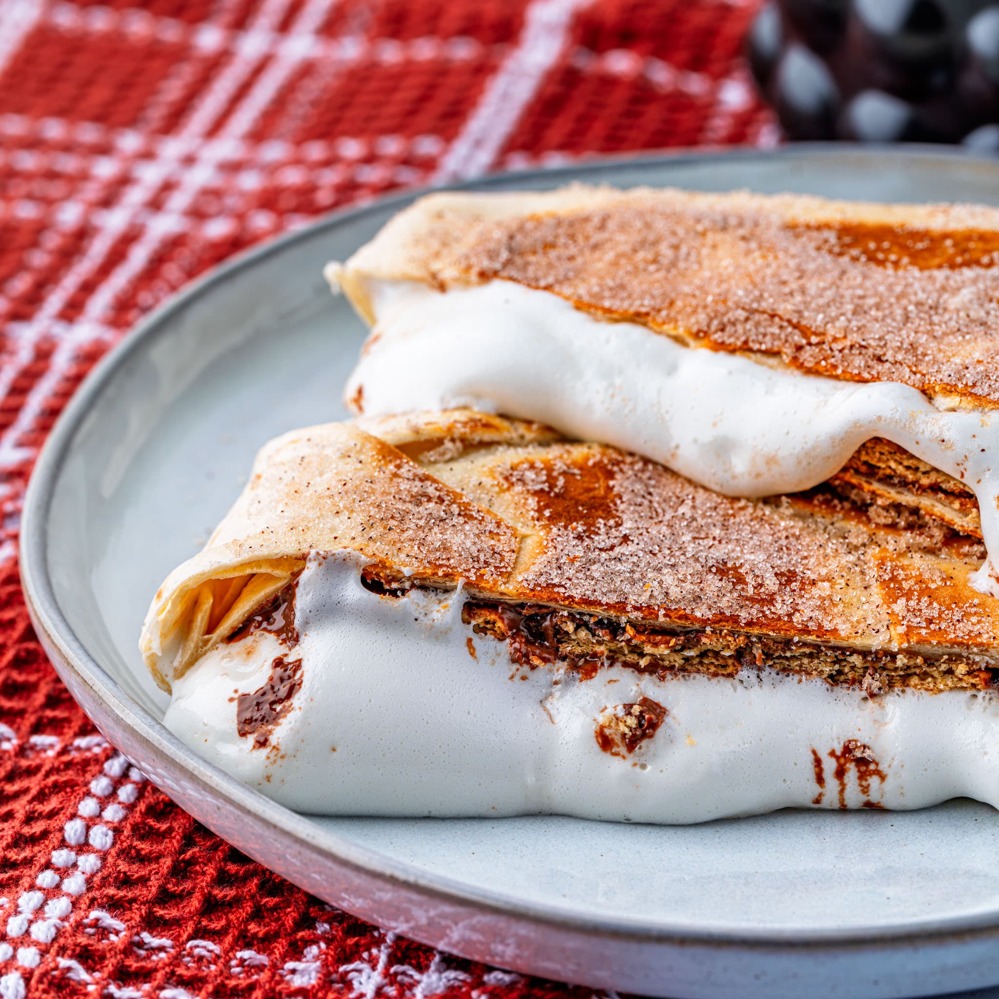 S'mores Crunchwrap — golden, cinnamon-sugar crusted, and ready to pull apart.