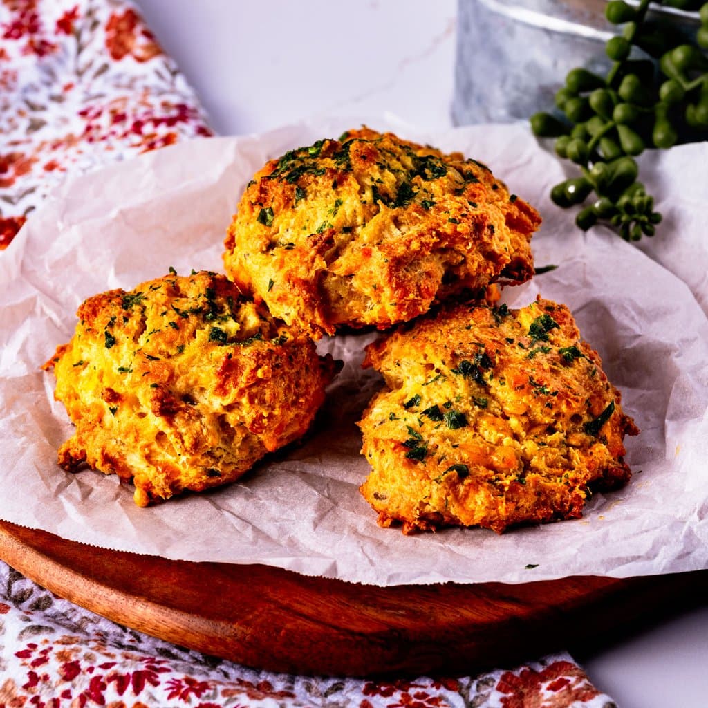 Golden cheddar bay biscuits fresh from the oven, brushed with garlic butter and flecked with fresh parsley.
