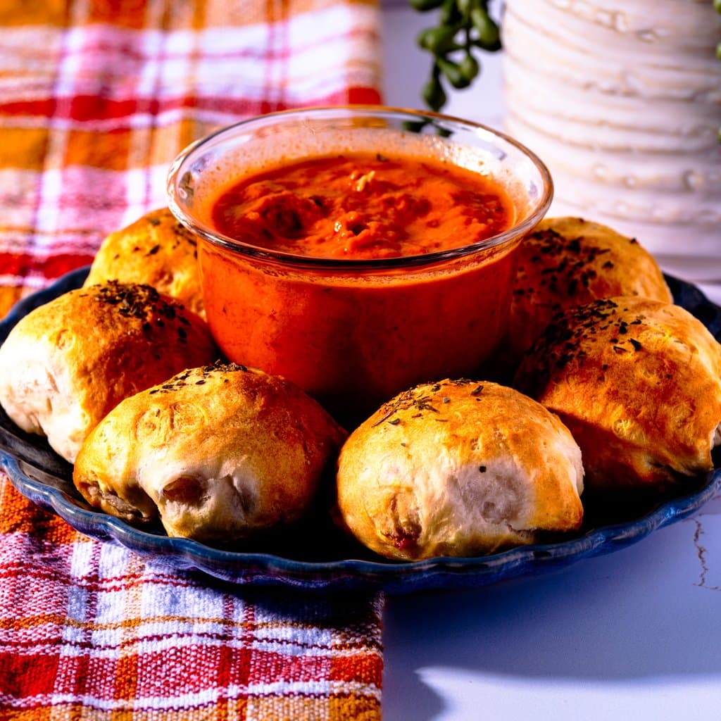 Golden air fryer pizza bites fresh out of the basket — crispy outside, melty cheesy inside.