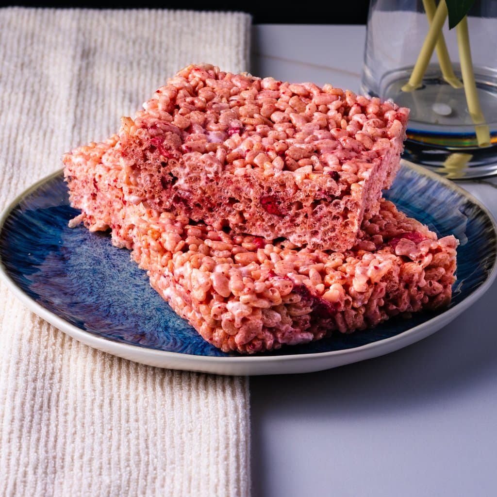Strawberries & Cream Rice Krispie Treats — pink, chewy, and packed with real strawberry flavor.