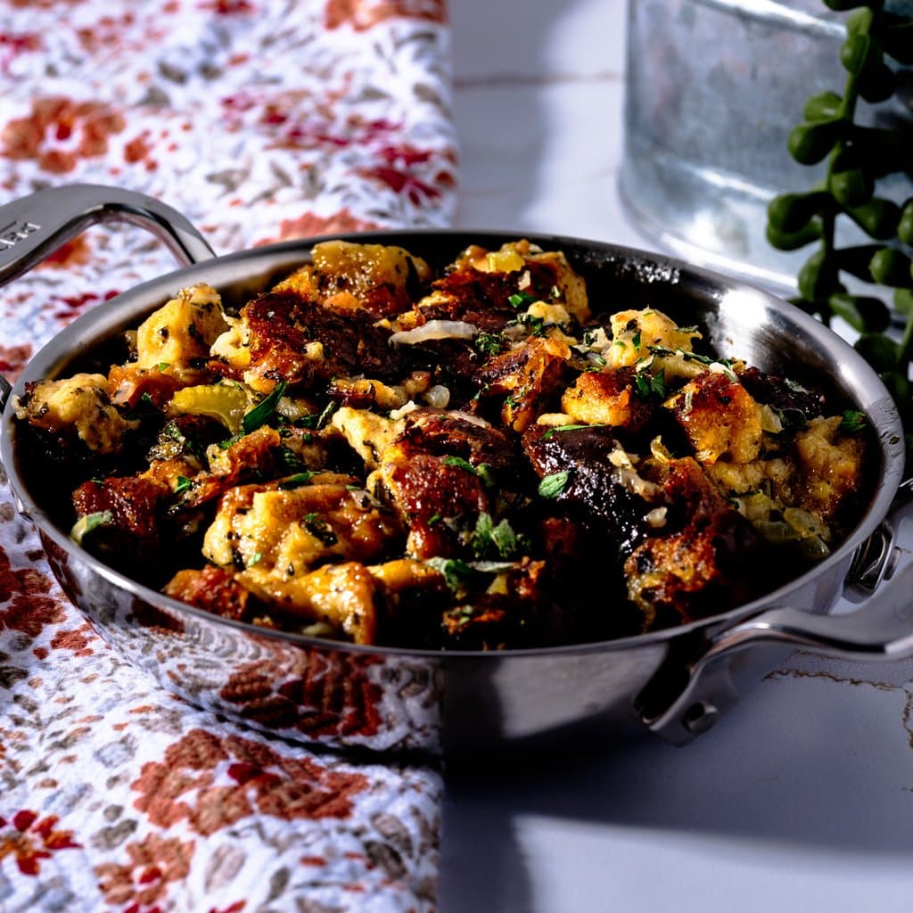 Golden, herb-flecked stuffing fresh out of the oven — crispy on top, soft and savory all the way through.