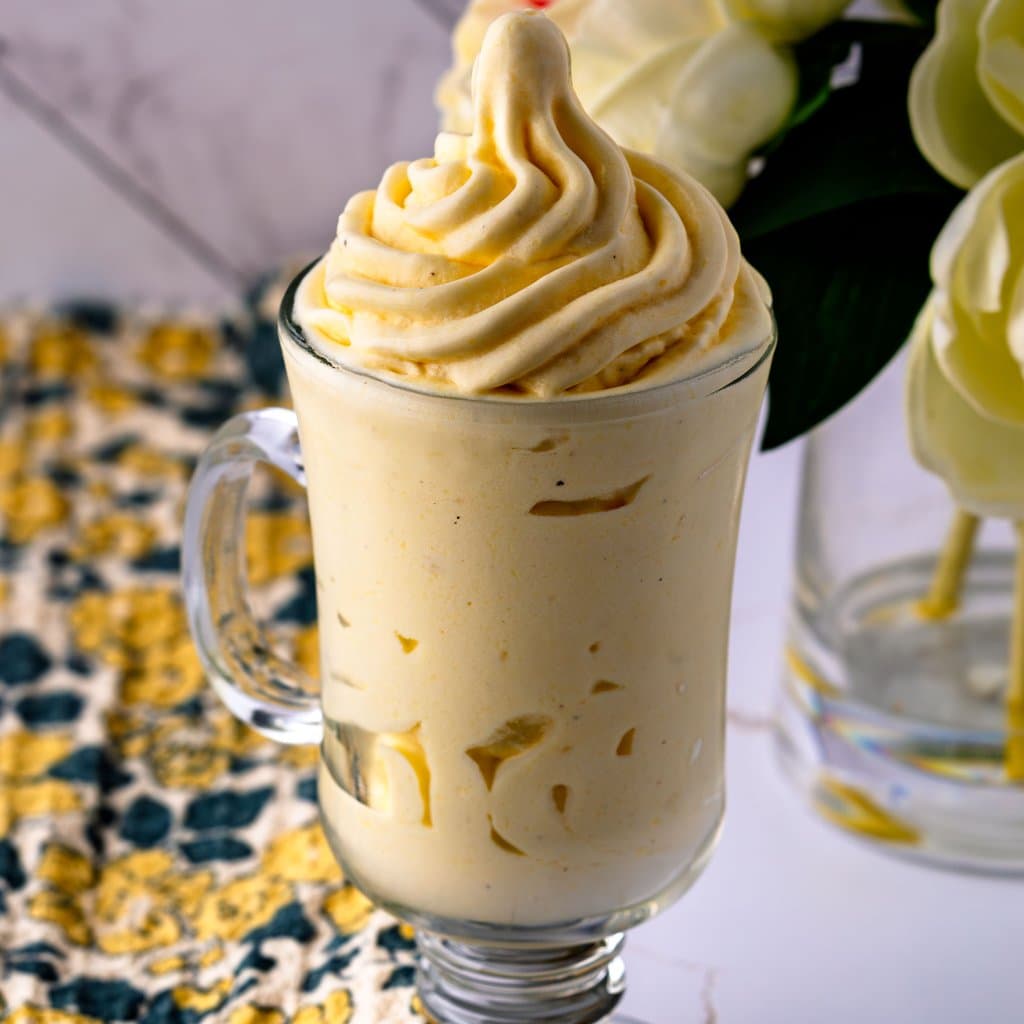 Homemade Dole Whip swirled into a cup — bright, creamy, and ready in minutes.