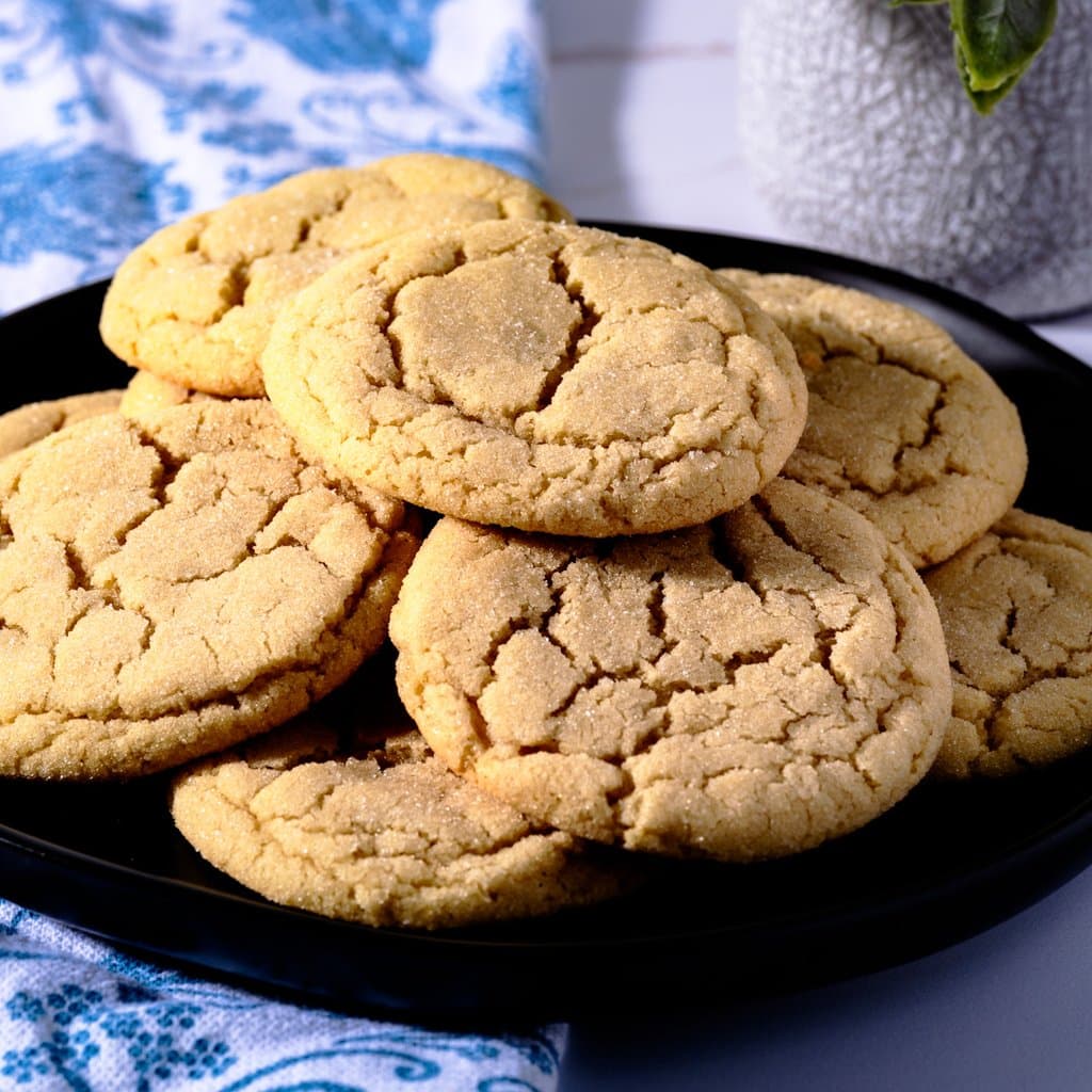 Golden-edged sugar cookies fresh from the oven, still warm on the pan — exactly how they should look.