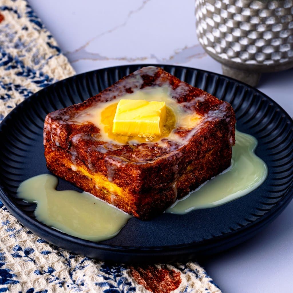 Hong Kong French Toast: golden, crispy brioche stuffed with Nutella and finished with sweetened condensed milk.