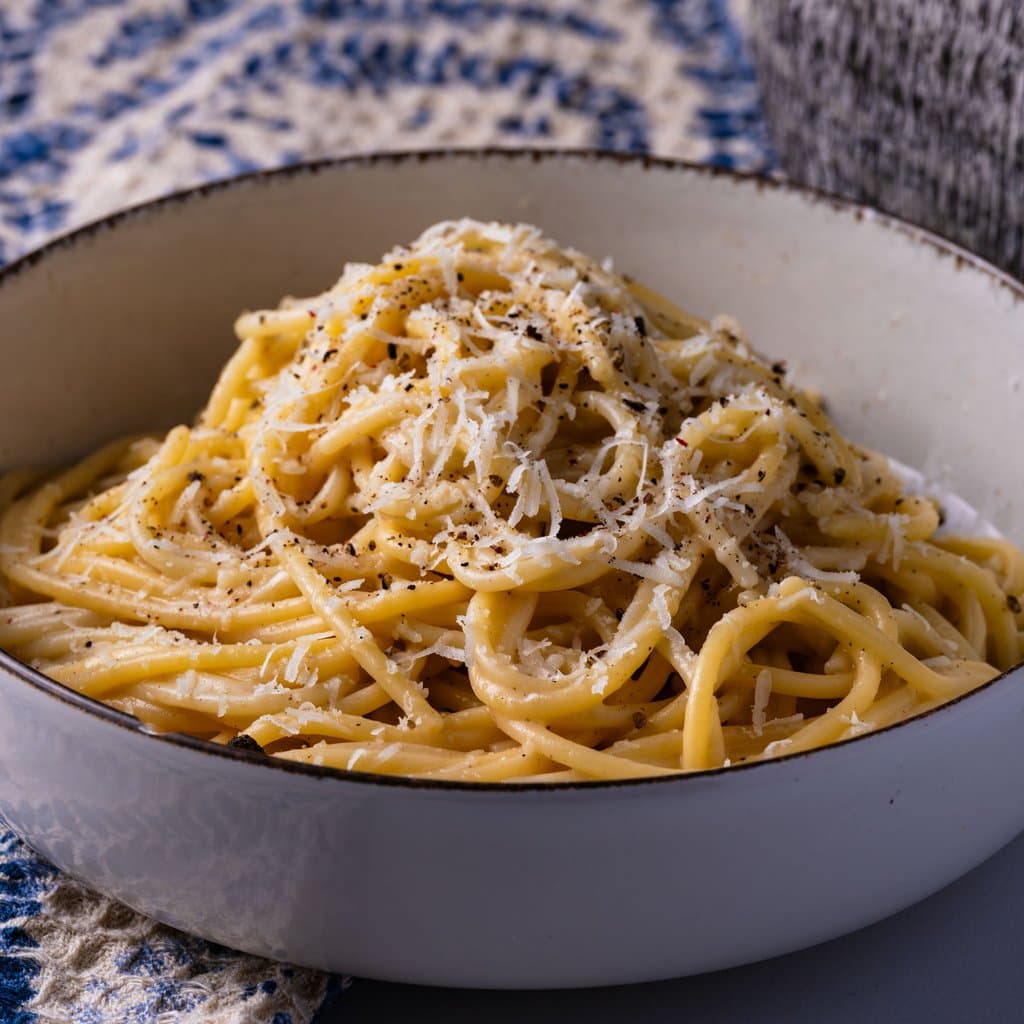 Cacio e pepe — twirled spaghetti coated in a glossy pecorino and black pepper sauce.