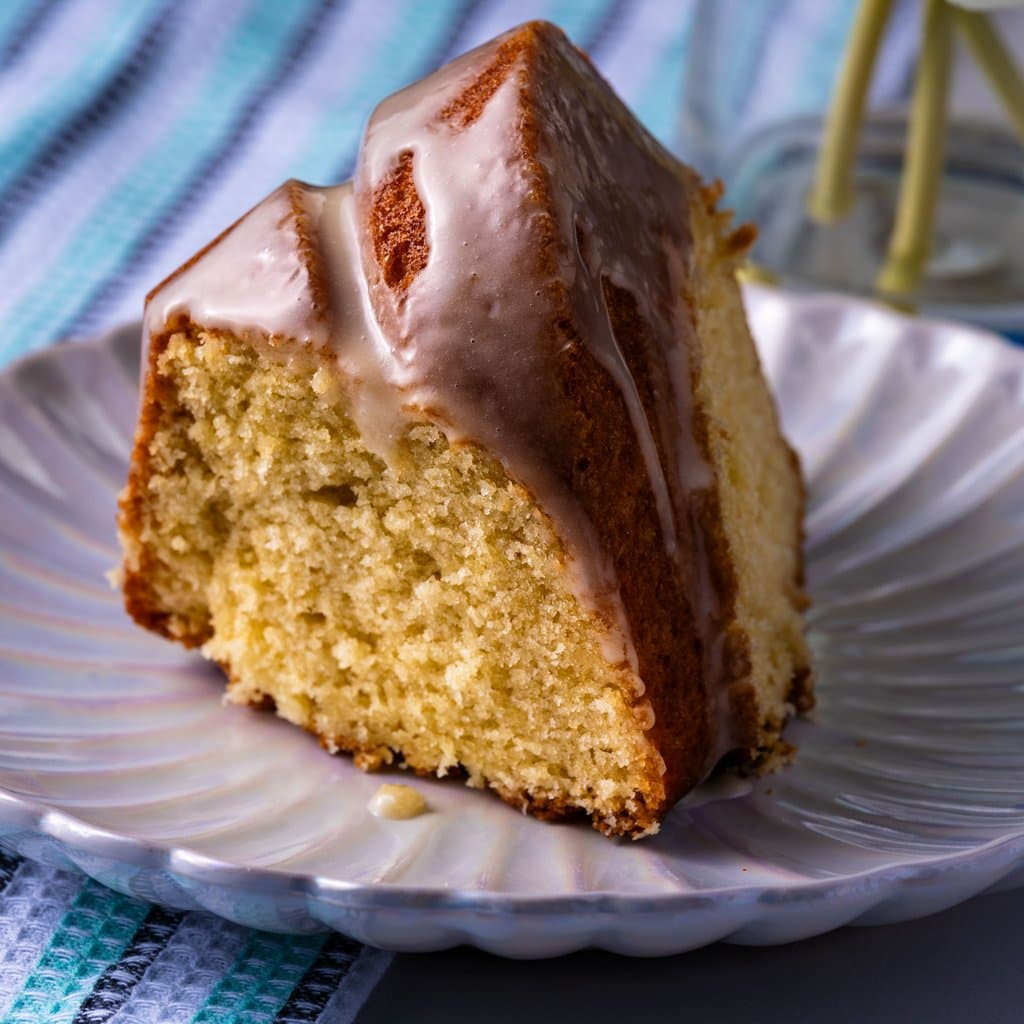 Honey Lavender Bundt Cake dusted with powdered sugar and drizzled with honey — straight from the Dowell Cooks studio in Tampa.