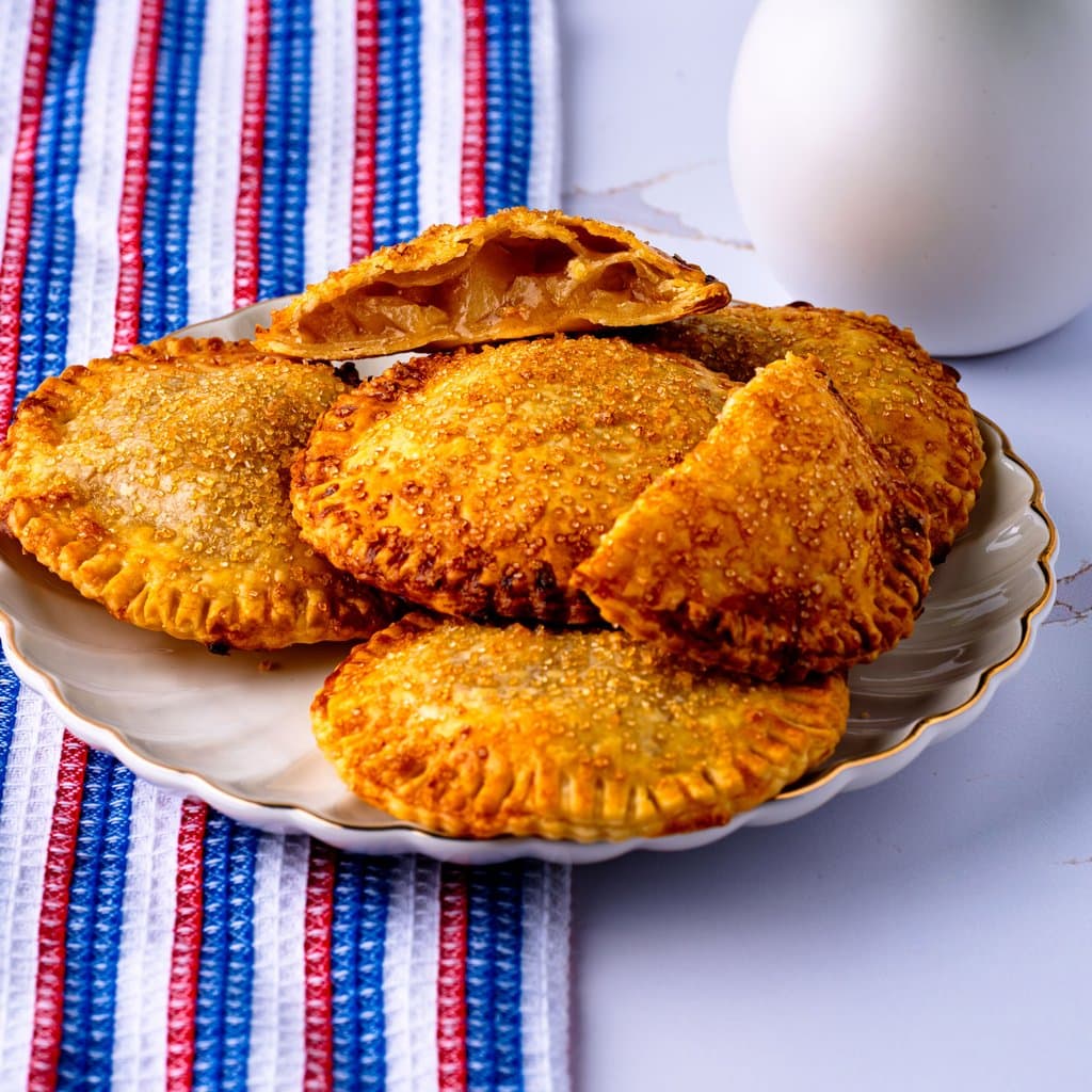 Golden, crispy air fryer apple hand pies dusted with sparkling coarse sugar.