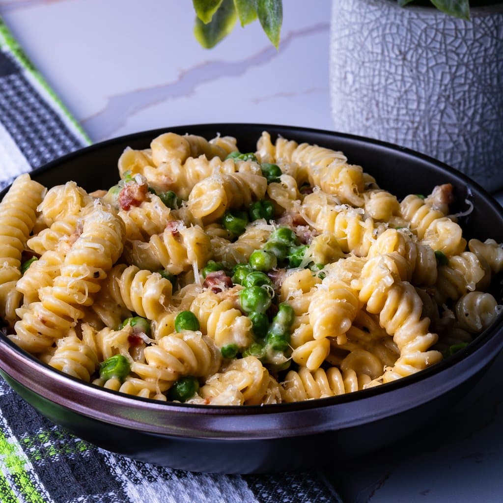 Pasta with pancetta and peas in a creamy Parmesan sauce — ready in 40 minutes.